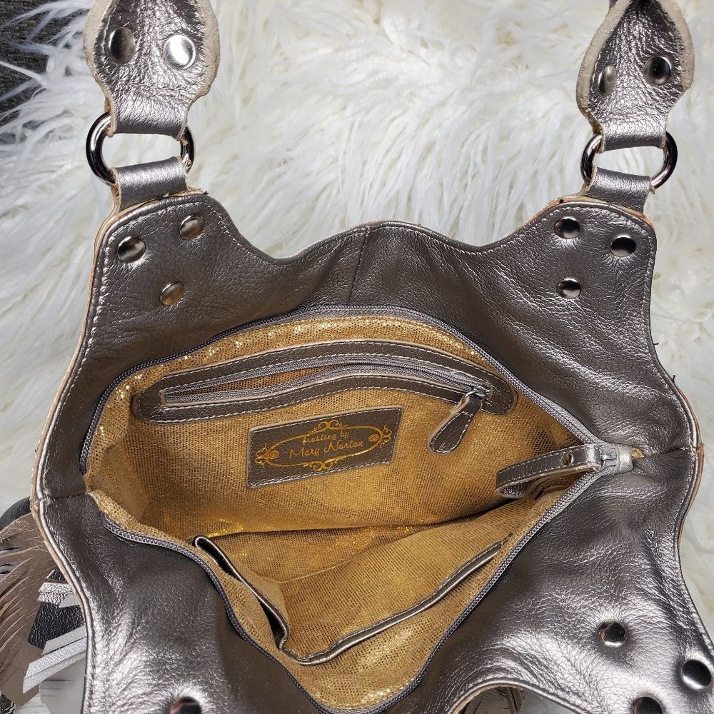 Frosting by Mary Norton, metallic silver and gold. Super clean, gently used.